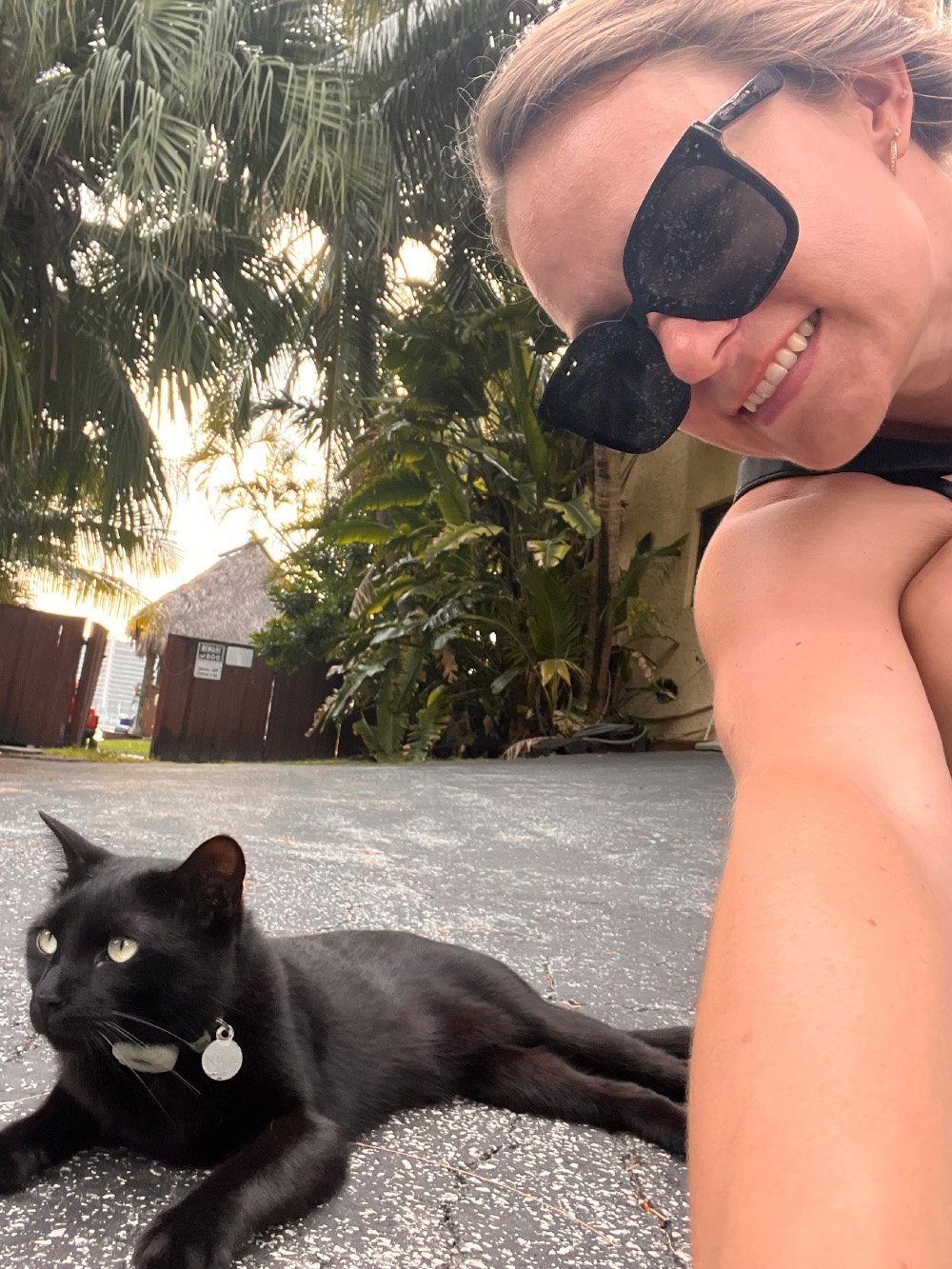 Cat and his owner outside